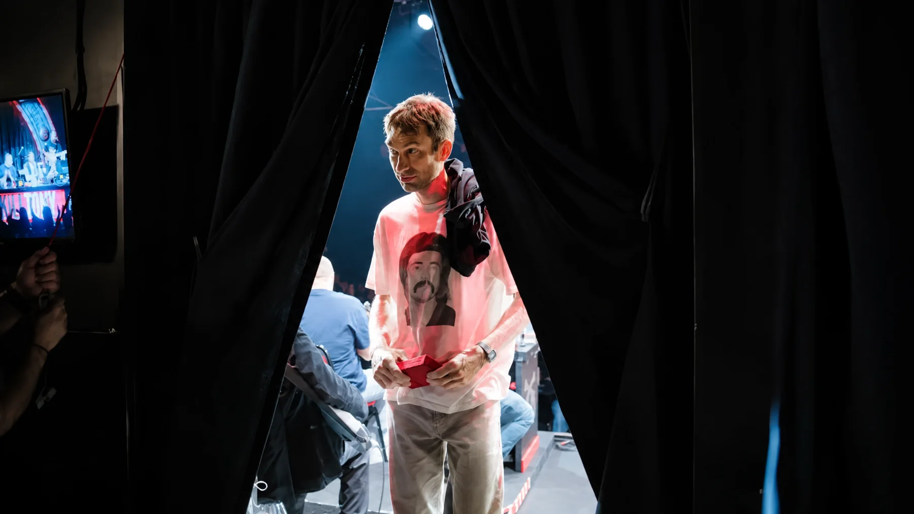 Shane Camp backstage passing through the curtain